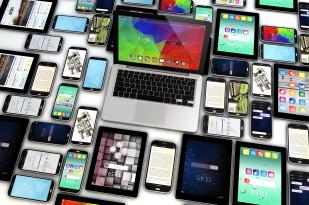 Overhead view of laptops, tablets and mobile phones